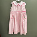 pink smock dress with heart pockets