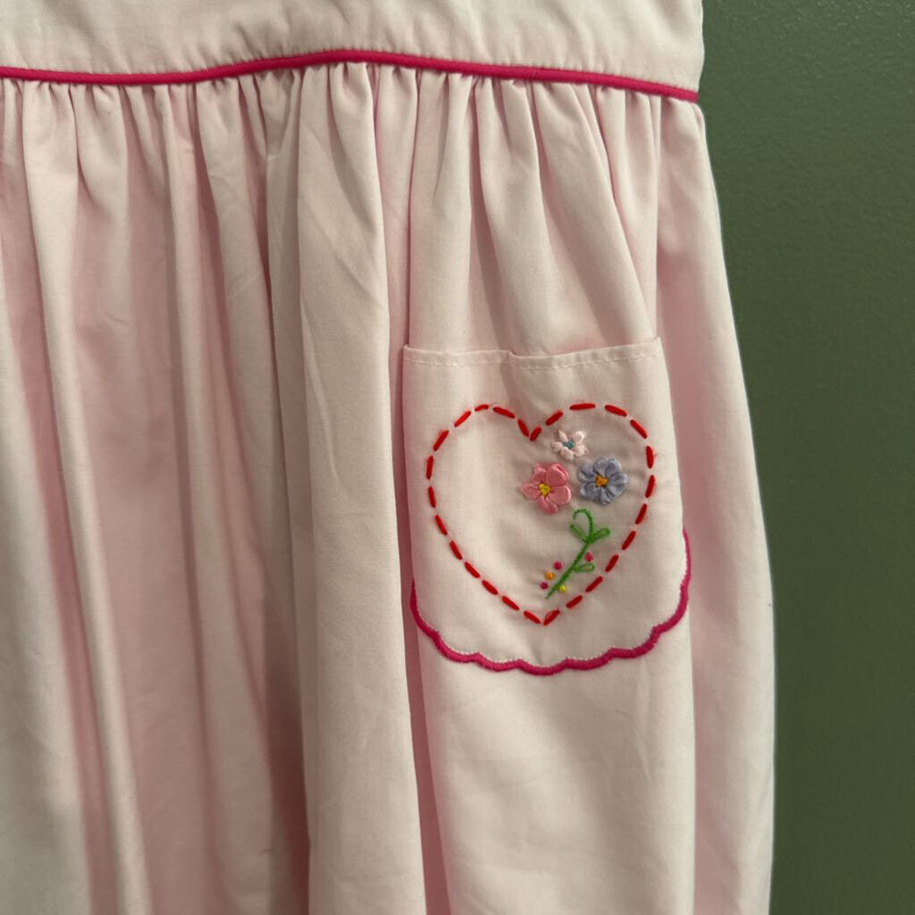 pink smock dress with heart pockets