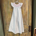 purple, pink, yellow, and blue flower smock dress